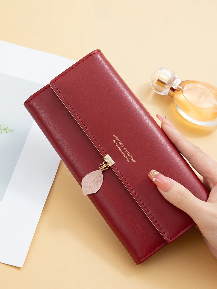Hot Selling spring and summer new women's PU leather Japanese and South Korea small fresh leaf pendant three fold bag large capa