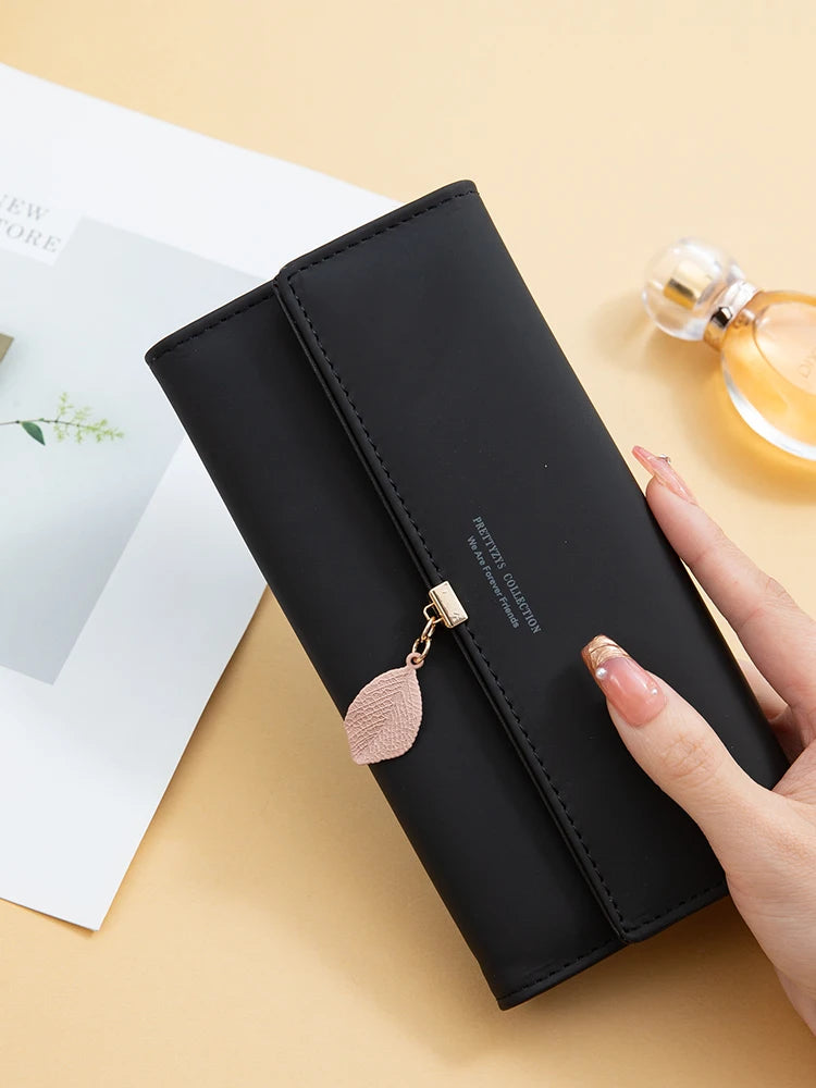 Hot Selling spring and summer new women's PU leather Japanese and South Korea small fresh leaf pendant three fold bag large capa