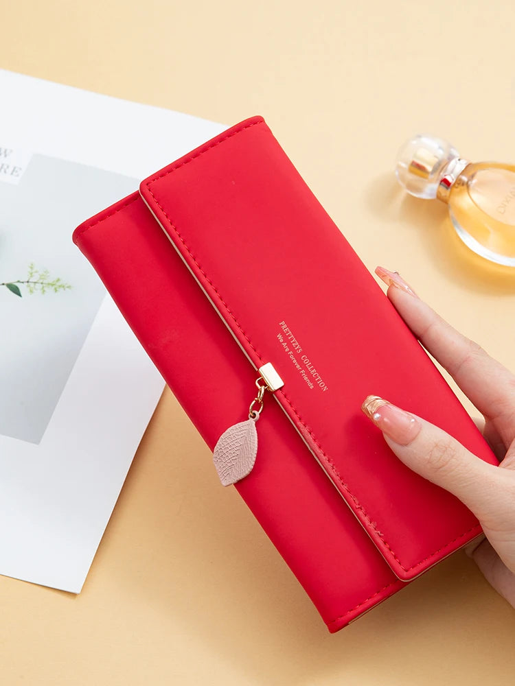 Hot Selling spring and summer new women's PU leather Japanese and South Korea small fresh leaf pendant three fold bag large capa