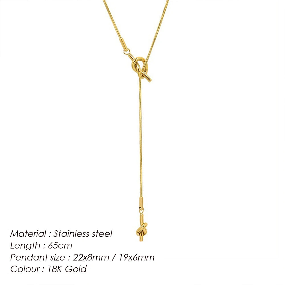eManco “Inner Dialogue Pendant” — Two Knots, One Chain: For the Woman Who Talks to Herself Before She Talks to the World