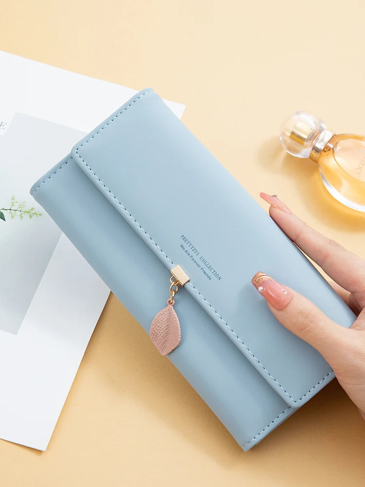 Hot Selling spring and summer new women's PU leather Japanese and South Korea small fresh leaf pendant three fold bag large capa