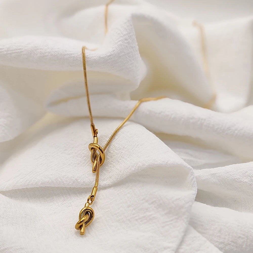 eManco “Inner Dialogue Pendant” — Two Knots, One Chain: For the Woman Who Talks to Herself Before She Talks to the World