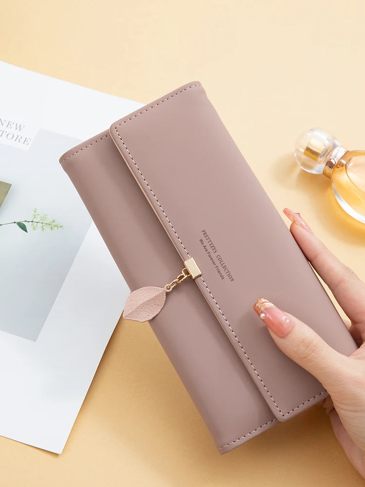 Hot Selling spring and summer new women's PU leather Japanese and South Korea small fresh leaf pendant three fold bag large capa