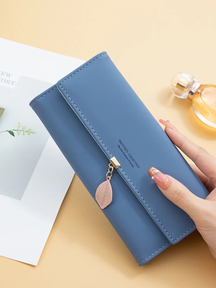 Hot Selling spring and summer new women's PU leather Japanese and South Korea small fresh leaf pendant three fold bag large capa