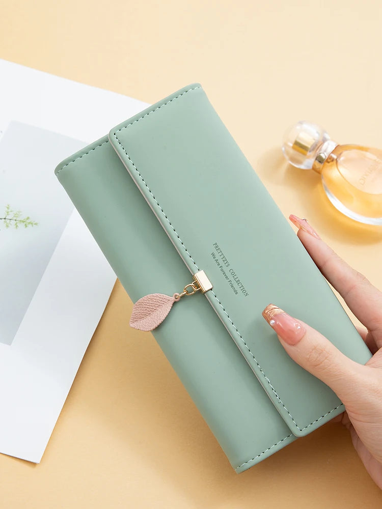 Hot Selling spring and summer new women's PU leather Japanese and South Korea small fresh leaf pendant three fold bag large capa